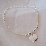 Sterling Silver Beaded Noodle Bracelet With Stamped Disc