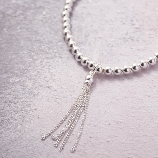 Sterling Silver Stretch Bracelet With Tassel Charm