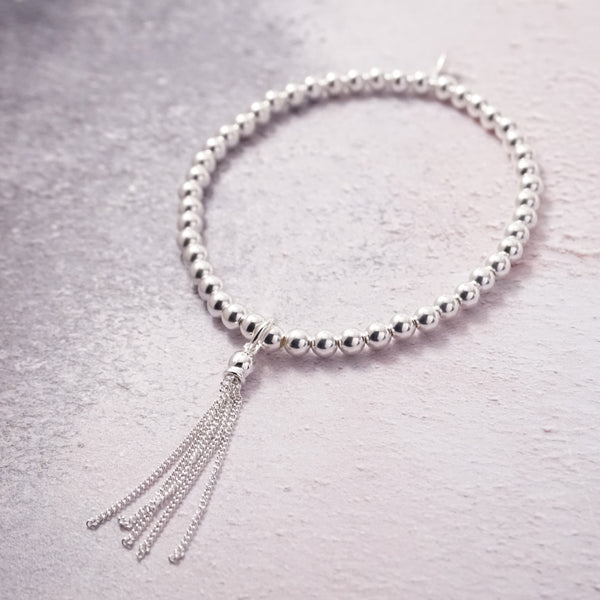 Sterling Silver Stretch Bracelet With Tassel Charm